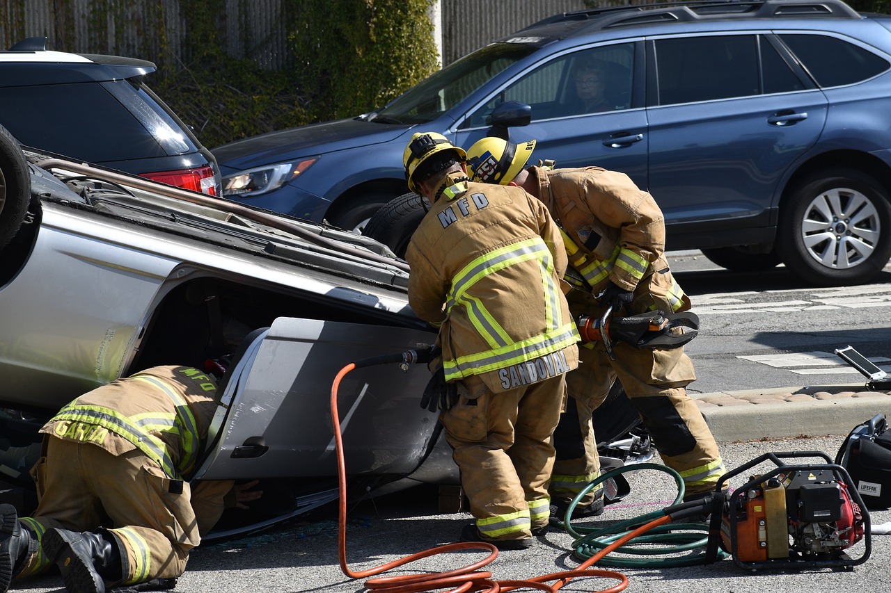A car wreck with the fire department rescuing a driver from the vehicle - Hardee County Personal Injury Lawyers concept images