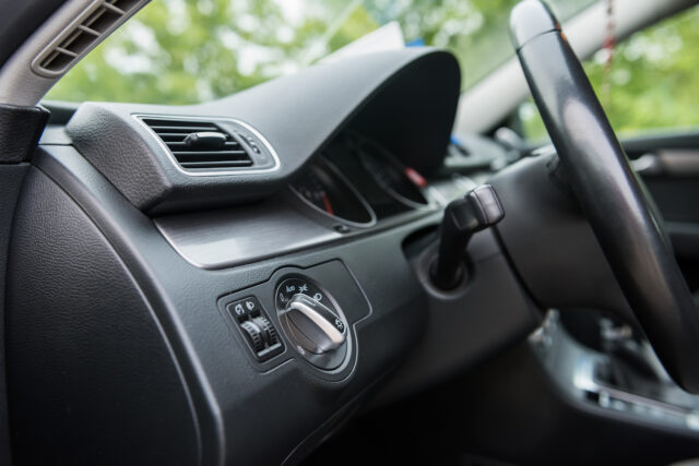 Salon of a new stylish car. Dark car interior
