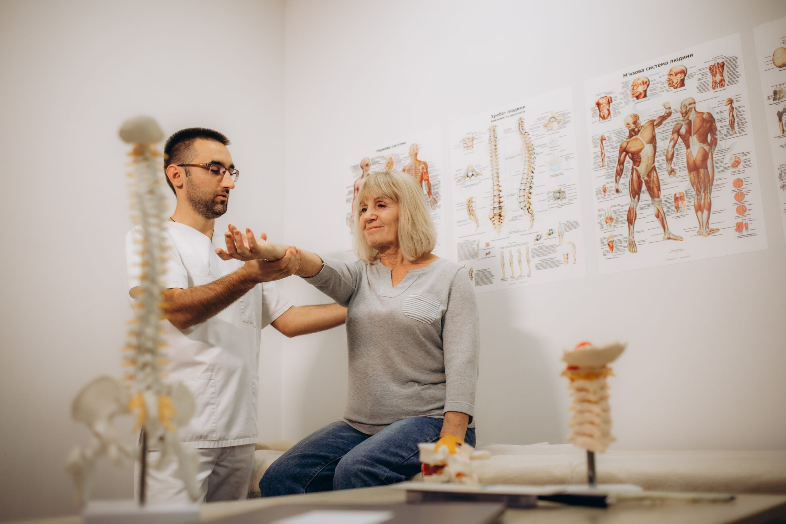 Senior woman getting the neck adjustment done in the medical office. High quality photo